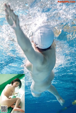 A man diving into a swimming pool from a diving board.